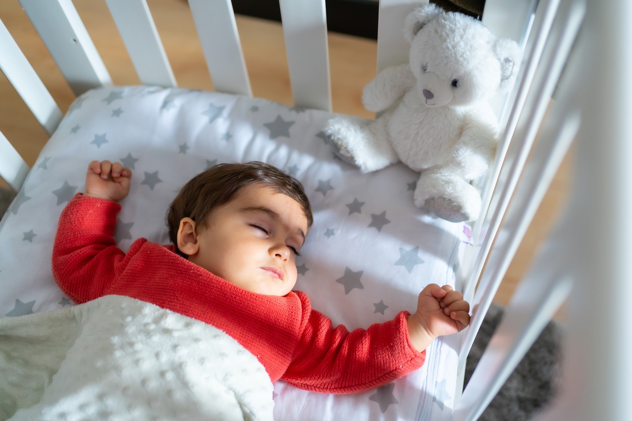 Baby napping in the crib